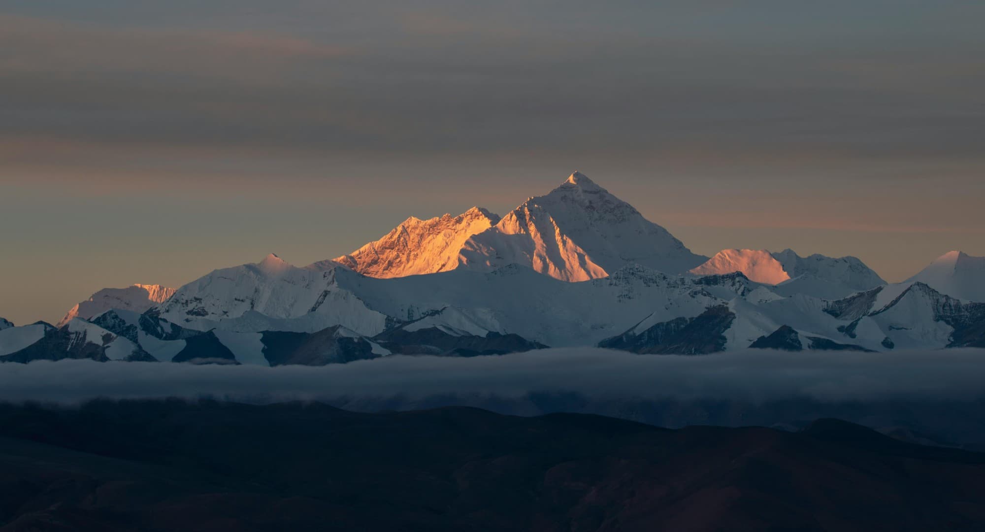 Sunset light on Mount Everest above the clouds